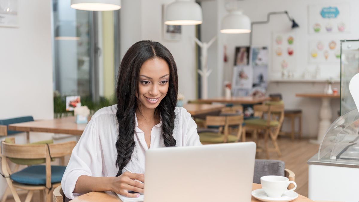 Beautiful woman working digitally MSN laptop