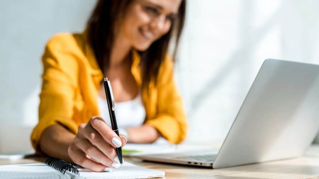 Freelance writer working on her computer