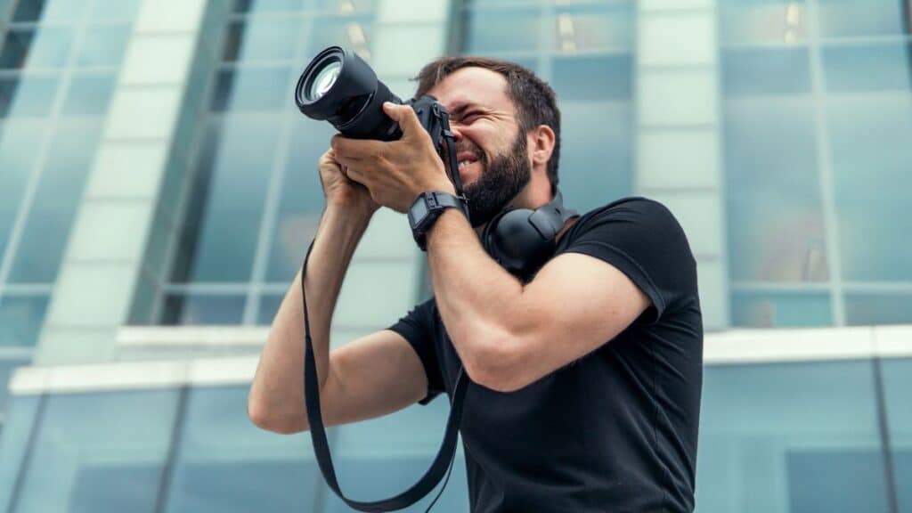 Man taking pictures outside