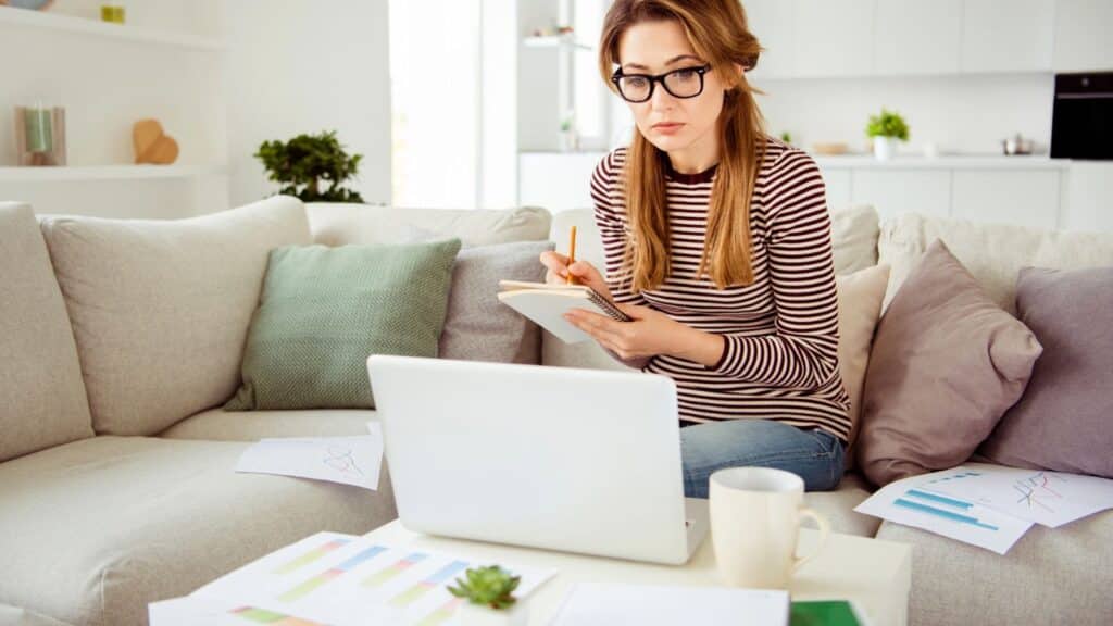 Young woman budgeting at her coffee table